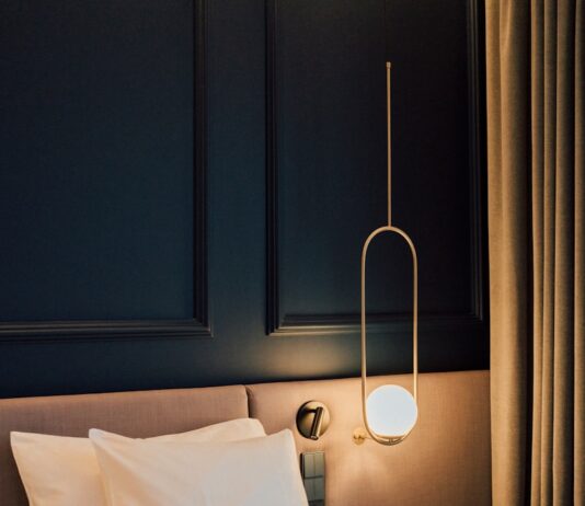 변화하는 여성 건강관리, 작은 습관이 만드는 큰 차이 a bed with white sheets and pillows in a room