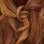 “내 머릿결 지키기, 트렌드와 함께 실천하는 건강 루틴” brown hair on white textile