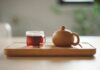 일상 속 대체요법, 건강한 습관으로 자리잡다 clear glass cup with tea near brown ceramic teapot
